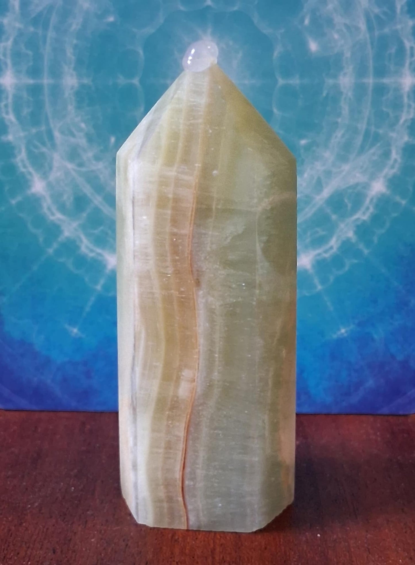 Crystals: Caribbean Calcite Point with brown banding