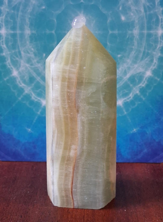 Crystals: Caribbean Calcite Point with brown banding